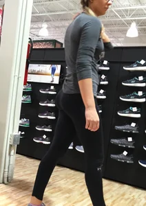 Shoe store employee with a sexy bubble butt in leggings