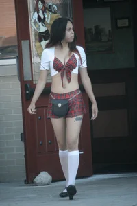 Two sexy Tilted Kilt employees showing cleavage and cheeks