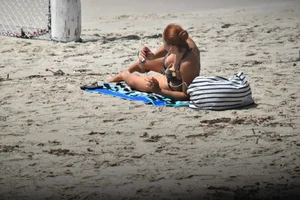 Redhead with nice tits in a bikini on the beach