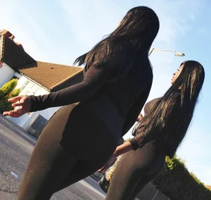 2 sexy black girls in leggings with nice asses