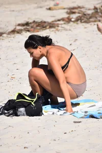Thick mature brunette bikini lady on the beach with a nice body