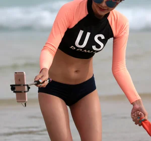 Skinny Asian milf on the beach with sexy body