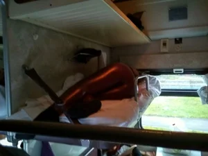 Candid girl wearing tight leather pants asleep in the public train sleeping car