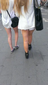 Street girlfriends in short dresses
