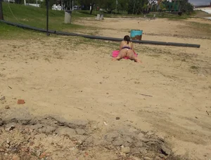 White thong brunette babe laying out on the beach with her dog
