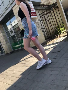 Hot chick wearing a fringed skirt walking up the stairs