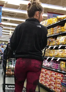 Milf grocery shopping in red leggings with a great ass