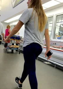 Blonde ass grocery shopping in blue and black leggings
