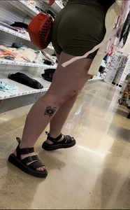 Juicy brunette in green spandex shorts OC