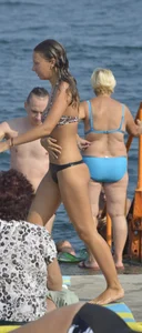 Sexy skinny babe in thong bikini on the beach