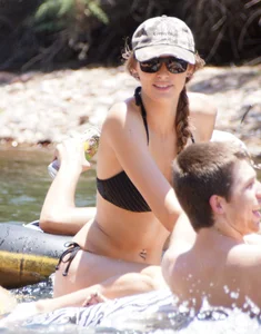 Sexy party girls in bikinis on a lake