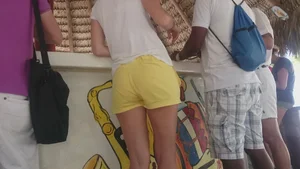 Milf in yellow shorts with vpl and a wedgie