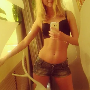 Cute Skinny Blonde Teen in a Top And Denim Mini Shorts Selfie in the Mirror