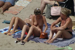 Girls on a nude beach in Sitges, Spain