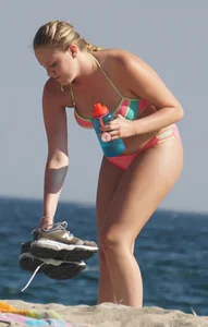 Thick blonde bikini babe on the beach
