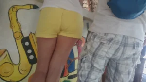 Milf in yellow shorts with vpl and a wedgie