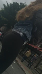 Girl with a nice ass in leggings walking down the street
