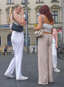 Long blonde braless in a white outfit (many pictures)