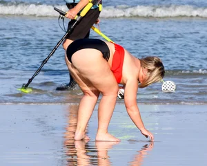 Thick BBW blonde lady in a bikini at the beach