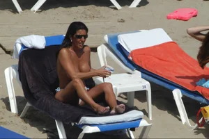 Girls on a nude beach in Sitges, Spain