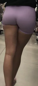Lavender spandex shorts on a brunette thot with long black nails