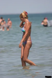 A bunch of sexy beach voyeur babes in bikinis, thongs and topless