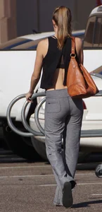 Sexy girl in the parking lot in tight grey sweatpants