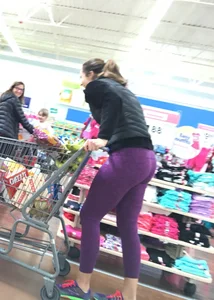 Milf shopping with a nice ass in purple leggings