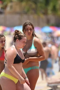 Big boobed beach girl in turquoise bikini and thong