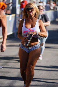 Sexy mature babe with huge boobs in tiny shorts showing her ass cheeks