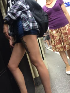 Hot Legs with a Tattoo in Subway Candid Closeup