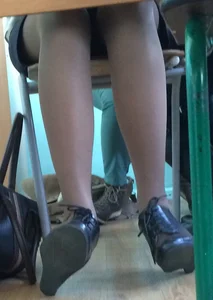 Legs of a College JB teen in Pantyhose And High-Heeled Shoes