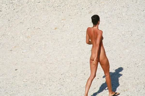 Ula FKK Sexy brunette on a nude beach topless, bottomless and with blue thong