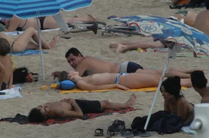 Topless girls on a beach in Barcelona