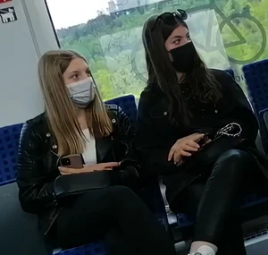 A couple of hot chicks in masks and tight pants sitting in a public bus creepshots