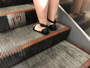 Stocky Legs of a Girl in a Dress And Feet in Sandals Subway Escalator Creepshots