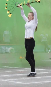 Girl in a Blouse and Leggings Performing on a Fire Show - Sexy Butt and Legs