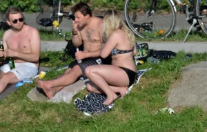 Thick blonde laying out in the sun in a bikini with her boyfriend