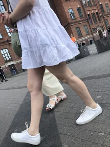 Young candid girl in a white dress, hot legs