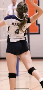 Teen girls playing volleyball
