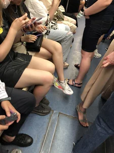 Hot Girls in a Subway Train Sitting With Crossed Legs Closeups And Flashing Booties Under Skirt