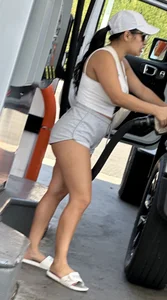 Sexy fit latina with cheeks coming out of booty shorts