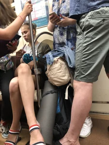 Tall Candid Teen Girl in Denim Shorts And Sandals Sitting in the Subway Train, Then Walking Down the Station