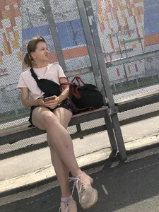 Bus Stop Girl Sitting with Crossed Legs Street Candid Photos