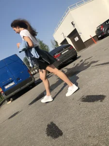 Awesome Candid Girl in a Leather Skirt And Sneakers Walking Down a Street, Then Flashing Her White Panties on the Stairs Creepshots Gallery