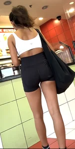 hot petite Indian chick showing some T&A in skimpy workout clothes