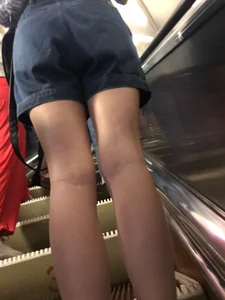 Candid teen in denim shorts
