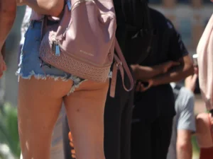Candid cheeky blonde in short jean shorts looking hot