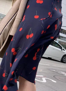 Business women with a visible thong in a see through Cherry Dress