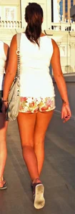 Girl in little floral shorts showing her cheeks